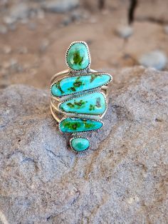 Expertly crafted with four freeform turquoise stones and a bold five shank design, the Patagonia turquoise ring is a true statement piece. Each stone is carefully selected for its unique beauty, making each ring truly one-of-a-kind. Elevate any outfit with this exquisite and versatile piece. Size is 7.5 but we can size it up one size or a 1/2 a size. Native American Artist: Smokey Gchache Native Turquoise Jewelry, Chunky Turquoise Jewelry, Turquoise Cowgirl, Real Turquoise Jewelry, Turquoise Engagement Ring, Vintage Turquoise Jewelry, Silversmithing Jewelry, Turquoise Jewelry Native American, Native American Artists