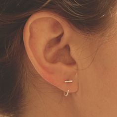 Simple and Modern enough to be worn on a daily basis. These tiny bars are soldered with solid 25mm sterling silver posts. Delicate and minimalist earrings you must have for casual wear or minimalist chic fancy occasions!+ Length - 3mm, 4mm, 5mm, 6mm, 7mm, 8mm, 9mm, 10mm, 11mm+ Material - Sterling Silver + Matte or Polished Finish+ Earring Posts are 20ga Solid Sterling Silver 25mm long+ Packaged in a Kraft Box+ Listing is for a pair+ Model is wearing the 6mm bar length *+*+*+*+*NOTE+_+_+_+_+_+The Hug Earrings, September Birthstone Jewelry, Hammered Hoop Earrings, Sapphire Studs, Chic Earrings, Minimalist Chic, Jewelry Hand, Handmade Fashion Jewelry, Earrings Ear