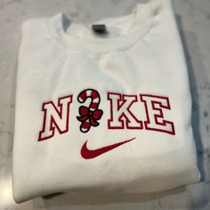 Not Nike Brand Please Allow Up To A Week To Ship Design Size Is 7x5 -Unisex Sizing True To Fit -Embroidered Design -Use Gildan Brand For Crewnecks, However There May Be A Substitute For A Similar Brand -Available In S, M, L, Xl, 2xl Size Of Design Is The Same For All Sizes Of Crewnecks So Design Will Look Smaller On A 2xl Compared To A S Material Is 50/50 Cotton/Polyester *Colors May Vary Slightly* Christmas Sweatshirt Ideas, American Eagle Sweatshirt, Ship Design, Carhartt Hoodie, Embroidered Nike, Quarter Zip Hoodie, Candy Cane Christmas, Christmas Graphic, Woven Jacket