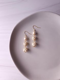 These earrings are made with Japanese paper cord called Mizuhiki. Each Awaji-dama knots ( Japanese version of monkey fist's knots) are handwoven in 2 sizes and matched with Japanese cotton pearl beads (Compressed Cotton). ➣COLOR Shiny Off-White ➣Shiny Silver White available here: https://dashofjapan.etsy.com/listing/1692361534 ➣SIZE Total Drop length (Approx.) : 4  cm / 1.57 inches ➣Earring Types -Brass (Hooks) -Brass (Ball Posts) ❀Earring Hook Upgrade available here https://www.etsy.com/listing/1744050508 ❀Ball Posts Upgrade available here https://www.etsy.com/listing/1758253897 ❀Clip-Ons upgrade available here https://www.etsy.com/listing/1738548323 ✎ CARE INSTRUCTIONS Items in Dash of Japan are handcrafted and very delicate. -Avoid contact with moisture. -Avoid fire or high heat, consta Monkey Fist Knot, Brass Hooks, Kimono Yukata, Earring Hook, Japanese Cotton, Japanese Paper, Photo Lighting, Yukata, Shiny Silver