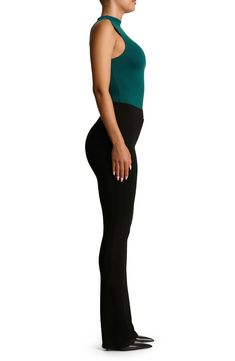 Sleek all-in-one style and breathable stretch jersey makes this thong bodysuit a svelte option for all your warm-weather plans. This form-fitting essential is made from the label's signature NW fabric, which is double lined, has four-way stretch, comfortable compression and a subtle crepe texture. Snap closure Funnel neck Sleeveless Lined 95% viscose, 5% elastane Hand wash, line dry Imported Casual High Waist Elastane Bodysuit, Casual High-waist Elastane Bodysuit, Fitted Shapewear Bottoms, Stretch Bodysuit With Built-in Bra, Stretch Bodysuit With Built-in Bra And High-cut Leg, Stretch Casual Bodysuit For Workwear, High Stretch Elastane Bodysuit For Night Out, Sleek Stretch Bodysuit For Spring, Fitted Elastane Bodysuit For Night Out