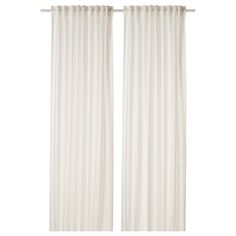 two white curtains hanging on a wall