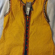 Heirloom Quality Top With Gorgeous Detail. Colors Are Vibrant. Mustard, Black, Gold, Red, Blue. Feminine Pleats. Hand Locked Print. Fabric Covered Buttons. Casual Yellow V-neck Vest, Mustard Sleeveless Tank Top For Summer, Mustard Fitted Sleeveless Top, Fitted Mustard Sleeveless Top, Yellow Cotton Summer Vest, Orange Cotton Sleeveless Tank Top, Yellow Cotton Vest For Summer, Orange Sleeveless Cotton Tank Top, Yellow V-neck Vest For Spring