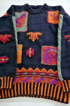 an old sweater with colorful designs on it