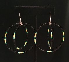 Native American Beaded hoop earrings. The outer hoop of these earrings measure 2" diameter and the inner hoop is 1" diameter. They are made with Czech beads and sterling silver hooks. I provide free U.S. shipping.  Handmade by a tribal member of the Caddo Nation of Oklahoma. Adjustable Colorful Beaded Circle Hoop Earrings, Adjustable Hoop Beaded Earrings With Dangling Beads, Adjustable Beaded Hoop Earrings, Adjustable Hoop Earrings With Colorful Beads, Adjustable Hoop Jewelry With Dangling Beads, Adjustable Small Beaded Hoop Earrings, Adjustable Small Hoop Earrings With Dangling Beads, Adjustable Small Hoop Jewelry With Dangling Beads, Adjustable Hypoallergenic Hoop Beaded Earrings