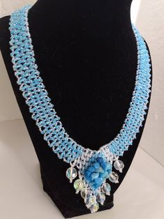 A handmade glass beaded necklace that is perfect for any occasion: parties, holidays, birthdays, anniversaries. All products are hand-crafted by my mother. Dimensions: - Length: 28.5 cm - Width: 22 cm Lightweight, high quality with a beaded hook as a clasp.  Acrylic Pearls: 8 mm. Will respond to concerns and suggestions promptly. Shipping costs: Free Domestic Shipping. All orders are sent by air-mail with tracking number. Time of delivery: Estimated 1-3 days for domestic shipping; international Glass Beaded Necklace With Beaded Chain For Party, Glass Beaded Necklaces For Party, Party Beaded Necklaces With Bead Caps And Round Beads, Glass Beaded Necklace For Party, Blue Glass Beaded Necklaces For Party, Party Beaded Necklaces With Bead Caps, Gift Crystal Beaded Necklace With Polished Beads, Handmade Round Crystal Necklace, Party Glass Beaded Necklace With Beaded Chain