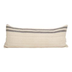 a white and grey striped pillow on a white background