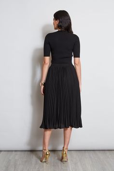 We love our chic pleated Midi skirt that 's designed with an elastic waist that gives it an easy sensibility. Our effortless Pleated Midi Skirt practically floats with movement, perfect for dressing up or down. T-Tahari Pleated Midi Skirt with an elastic waistband Runs True to Size Model is 5'9" and wearing size S Dry Clean Only Imported Style #: THF41045 Black Pleated Skirt Outfit, Professional Fits, Minimalist Goth, Black Pleated Midi Skirt, Pleated Skirt Outfit, Black Pleated Skirt, Dressing Up, Black Midi Skirt, Career Dress