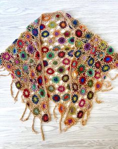 Embrace the natural beauty of the outdoors with this intricately hand-crocheted triangle wrap, adorned with charming, colorful, floral patterns and playful fringe details. Generously sized for easy layering, this shawl is the perfect companion for festival days or cool, breezy evenings. Drape it effortlessly over your favorite outfits to add a light, cozy layer with an air of vintage romance. Crafted from soft, lightweight yarn, this shawl flows elegantly across your shoulders, offering a touch Web Crochet, Crochet Triangle, Crochet Shawls And Wraps, Triangle Shawls, Vintage Romance, Crochet Wrap, Pitcairn Islands, Equatorial Guinea, Floral Patterns