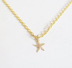 Dainty gold filled tiny starfish necklace Great for everyday wear Light and simple piece Reflects nicely in light Item details: Starfish measures 8mm by 8mm Length of 14k gold filled chain 14 - 18 inches Comes in a nice gift box Makes for a great gift If you would like a note with your item please write the note at the checkout page in the notes to seller section and if you would like a name included in the note . . . . . . . . . . . . . . . . . . . . . . . . . . . . . . . . . . . . . . . . . . Dainty Gold Starfish Charm Necklace, Gold Starfish Charm Necklace Gift, Gold Starfish Shaped Dainty Jewelry, Dainty Starfish Gold Jewelry, Dainty Gold Starfish Jewelry, Dainty Gold Starfish Necklace, Small Necklace, Starfish Necklace, Bridesmaid Necklace