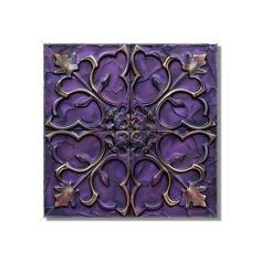 an intricately designed purple tile with leaves on it