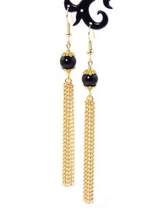 Clip-on style also available! Semi precious black Agate stones coupled with gold tones give these tassel chain earrings a classy chic look while still making a statement! Earrings are lightweight making them very wearable! Earring hooks are 22k gold plated hypoallergenic and will help to avoid irritating the ears. Prod Elegant Dangle Tassel Jewelry, Elegant Evening Jewelry With Tassels, Formal Dangle Tassel Earrings, Chic Gold Tassel Earrings For Formal Events, Chic Gold Tassel Earrings For Formal Occasions, Chic Evening Earrings With Tassels, Elegant Long Drop Tassel Jewelry, Black Dangle Tassel Jewelry, Black Dangle Jewelry With Tassels