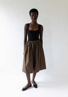 Brooke Callahan Tie Skirt in Chocolate Cotton Bottoms With Gathered Waist For Daywear, Daywear Bottoms With Gathered Waist And Tiered Skirt, Daywear Tiered Skirt With Gathered Waist, Relaxed Tiered Skirt With Gathered Waist, Chic Flared Skirt With Gathered Waist, Chic Cotton Gathered Skirt Bottoms, Chic Cotton Gathered Skirt, Chic Cotton Skirt With Tie Waist, Gathered Waist Midi Skirt