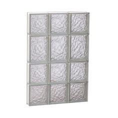 a white glass block wall with many squares on the bottom and one square in the middle