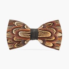 a wooden bow tie with feathers on it