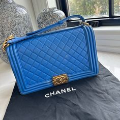 Authentic Chanel Shoulder Bag Blue Lambskin Leather Interlocking Cc Logo Quilted Pattern & Chain-Link Accent Gold-Tone Hardware Chain-Link Shoulder Strap Grosgrain Lining & Single Interior Pocket Push-Lock Closure At Front *Shoulder Strap Drop Max: 18" *Shoulder Strap Drop Min: 11" Wear Throughout, Please See Photos. Price Reflects. Luxury Blue Square Shoulder Bag, Designer Blue Square Bags, Classic Blue Bag With Original Box, Luxury Blue Shoulder Bag For Formal Occasions, Classic Blue Evening Bag, Luxury Blue Bags For Everyday, Designer Blue Bag For Formal Occasions, Blue Square Bag With Gold-tone Hardware, Blue Square Bags With Gold-tone Hardware