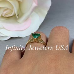 This ring is a trillion lab created green emerald made in solid 14k yellow gold item #5843 Ring has split shank design and 3 prong setting. Emerald is the birthstone for May Gem Type: lab created emerald -Shape: Trillion / 7x7MM -Weight: 1.00ct (approx.) diamond equivalent -Stone Color: Lively Medium Green, Eye-clean / The Best Color in Emeralds -Hardness: 8.5 Moh's Scale Mounting: -Metal Type and Purity: 14k yellow gold -Setting: 3 prong split shank design -Listed Ring Size: 6.5 -Country of Man Triangle Ring, Lab Created Emerald, Emerald Engagement, Yellow Gold Setting, Emerald Engagement Ring, Stacking Rings, Promise Rings, Prong Setting, Types Of Metal