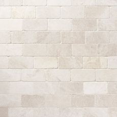 a white brick wall with no mortars on it