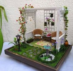 a miniature garden is set up on a table