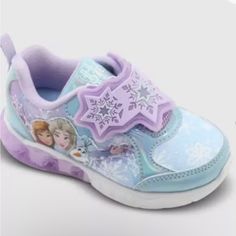 Get Your Little Girl Ready For A Frozen Adventure With These Disney Girls' Frozen Sneakers. These Laceless Light-Up Shoes Feature Elsa And Anna Characters, And A Hook And Loop Closure For Easy On And Off. The Sneakers Come In A Size 7 Us Shoe Size Or 40 Eu Shoe Size, And Are Perfect For Everyday Wear. The Manmade Upper Material And Rubber Outsole Make These Sneakers Durable And Long-Lasting. With Their Purple Color And Frozen Theme, They Are Sure To Be A Hit With Any Little Girl. These Athletic Shoes Disney, Elsa And Anna, Frozen Theme, Disney Shoes, Light Up Shoes, Disney Girls, Athletic Sneakers, Toddler Sizes, Hook And Loop