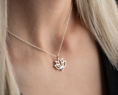 Elevate your style and spirituality with our Handmade Gold Lotus Necklace featuring a custom birthstone--a unique blend of personalized elegance and meaningful symbolism. Crafted with meticulous care, this exquisite piece is available in two exceptional materials: 925 sterling silver and 14K solid gold. Choose between the timeless allure of silver and the enduring warmth of gold, knowing that both options are of the highest quality. While the material is a significant choice, the true essence of this necklace lies in the delicate lotus pendant adorned with a custom birthstone. The lotus, a symbol of purity and enlightenment, is a captivating representation of beauty emerging from the depths. The added personal touch of a custom birthstone enhances the necklace's significance, making it a p Spiritual White Gold Necklace With Birthstone, Personalized Spiritual White Gold Jewelry, Spiritual Sterling Silver Birthstone Jewelry, Symbolic Birthstone Jewelry For Gift, Symbolic Gift Jewelry With Birthstone, Spiritual Sterling Silver Birthstone Necklace With Gemstone, Spiritual Yellow Gold Sterling Silver Birthstone Necklace, Rose Gold Sterling Silver Birthstone Necklace, Spiritual Rose Gold Birthstone Jewelry