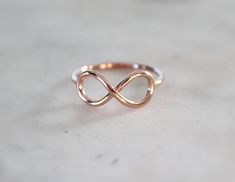 I craft each 14kt gold filled infinity just for you! →You pick between Yellow OR Rose gold filled. Its strong and sturdy but with a dainty look! Great gauge for rings sizes up to size 10 1/2! If you would like larger than 10.5 message me! P R O D U C T I O N ~ T I M E : Depending on my current amount of orders, it usually takes me 1-2 weeks to craft your item. Message me if you need a rush order! Check out my other infinity rings in Solid 14kt Yellow Gold: https://www.etsy.com/listing/171171945/ Hypoallergenic Rose Gold Infinity Jewelry, Handmade Gold Infinity Jewelry, Gold Infinity Ring, Infinity Rings, Infinity Ring, Ring Rose Gold, Favorite Rings, Gold Filled Jewelry, 14kt Gold