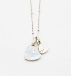 Mother of Pearl Initial Necklace – Rellery. For Valentine’s Day Everyday Initial Pendant Necklace With Heart Charm, Sterling Silver Pearl Charm Necklace, Everyday Sterling Silver Necklace With Pearl Charm, Sterling Silver Heart Charm Necklaces With Initials, Elegant Heart Charm Initial Pendant, Everyday Heart Charm Necklace For Mother's Day, Heart Beads Necklace For Mother's Day, Everyday Heart Beads Necklace For Mother's Day, Everyday Heart Bead Charm Necklaces With Heart Pendant