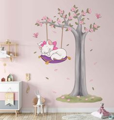 a child's bedroom with pink walls and white furniture, including a swinger in the shape of a tree