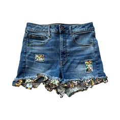 Effortless style all day long. These upcycled jean shorts with a ruffle trim are a favorite of mine. The rich, luxurious print has a cheerful, fun vibe that's perfect for sunny days.  To maintain the deconstructed look, I placed matching patches behind the short's tears. A great summer staple! SIZE OPTIONS: You can choose to request a custom size, mail your own jeans, or purchase an already made size: 1. Custom Size Request: Select "Size Request" from the drop-down box and enter your desired siz Casual Upcycled Bottoms For Spring, Playful Medium Wash Bottoms For Spring, Playful Blue Jean Shorts For Spring, Playful Spring Jean Shorts, Trendy Cotton Ruffle Shorts, Playful Denim Shorts, Fun Cotton Shorts For Spring, Playful Cotton Jean Shorts For Summer, Ruffled Denim Jean Shorts For Summer