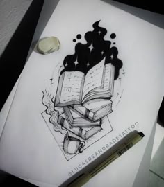 a drawing of an open book on top of a piece of paper