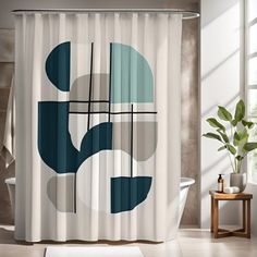 a white shower curtain with blue and green shapes on it