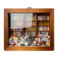 a wooden book case filled with lots of books