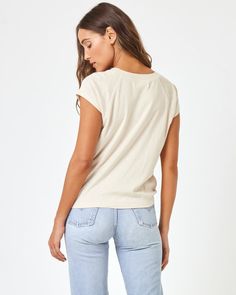 Our coveted All Day tee got a new luck in a dreamy lightweight fabric. The Sunday Tee has the same fit you know & love, featuring slightly cropped sleeves. Your new favorite everyday basic! Short Sleeve Ribbed Collar Airy Slub Rib Size XS-XL 60% Cotton 40% Viscose Like all delicates, shape, color and fit are best preserved if hand washed in cold water. Lay flat to dry. Style # SDYTP24 Model Measurements: Anna, size S - Height 5'9, Bust 32", Waist 23", Hips 34.5" Effortless Spring T-shirt For Casual Gatherings, Versatile Spring T-shirt For Casual Gatherings, Trendy Short Sleeve Knit Top For Loungewear, Effortless Spring Everyday T-shirt, Summer Short Sleeve Top, Soft-washed For Everyday, Soft-washed Relaxed Fit Tops For Spring, Relaxed Fit Soft-washed Tops For Spring, Effortless Short Sleeve T-shirt For Spring, Soft-washed Relaxed Tops For Casual Wear