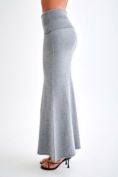 Winter bliss.Elevate your wardrobe with the KARLIE Knit Maxi Skirt, a timeless piece designed for both elegance and comfort. Featuring a mid-rise waist and a sleek hip overlay, this skirt effortlessly flatters your silhouette. The maxi length and fishtail hem add a touch of sophistication, making it perfect for any occasion. Crafted from a soft, unlined knit, the Karlie Knit Maxi Skirt ensures a comfortable fit while maintaining a chic and polished look. For a complete ensemble, pair it with the Karlie Off Shoulder Knit Top and step out in effortless style. Stretch Long Skirt For Fall, Stretch Long Skirt Bottoms For Fall, Waist-length Fitted Skirt Solid Color, Stretch Long Skirt For Loungewear, High Waist Stretch Solid Maxi Skirt, Stretch High Waist Maxi Skirt, Versatile Full-length Stretch Skirt, Stretch Loungewear Skirt With Elastic Waistband, Stretch Skirt With Elastic Waistband For Loungewear