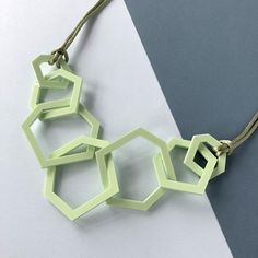 Contemporary pistachio green mid-century geometric link necklace which is perfect for the woman who likes modern jewellery. My necklaces are light and easy to wear and will give your favourite outfit an istant pop of colour. This seven link necklace is my 'between' size, not as dramatic as my twelve link necklace and more of a statement than the three link one. It is mid-length and measures 26 inches long and hangs 13.5 inches from the clasp to the bottom link.  Three sizes of laser cut geometri Trendy Geometric Green Jewelry, Trendy Green Geometric Jewelry, Modern Green Necklace As Gift, Modern Green Necklace As A Gift, Modern Green Necklace For Gift, Modern Green Geometric Jewelry, Geometric Green Jewelry Gift, Green Geometric Jewelry For Gifts, Green Geometric Jewelry For Gift