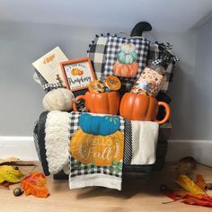 a basket filled with pumpkins and other items