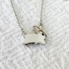 "Dainty BUNNY necklace . little bunny . small rabbit necklace . easter necklace . spring necklace . 925 Rhodium Plated STERLING SILVER . Material: 925 Rhodium Plated Sterling Silver   Chain: .5mm . Pendant size:  1/4\" (12mm) . Comes in a cute reusable gift box . Please let me know if you want more details or pictures Silver material is lifetime guaranteed. Thank you very much for looking!" Cute Silver Hypoallergenic Necklace, Easter Bunny Design Jewelry Gift, Silver Bunny Design Jewelry For Gifts, Silver Bunny Design Jewelry Gift, Silver Jewelry With Bunny Design For Gift, Easter Necklace, Small Bunny, Spring Necklace, Rabbit Necklace