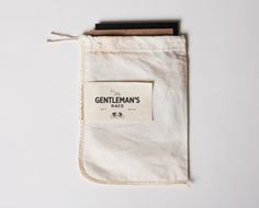 a white bag with a label that says gentleman's race