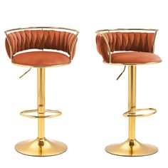 two gold metal barstools with orange velvet upholstered seats