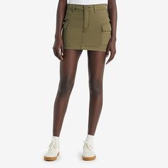 Your favorite cargo-in skirt form. With an ultra-flattering mid-rise and an above-the-knee length cut, our mini cargo skirt features oversized patch pockets and an effortless '90s style.Front Style: Flat FrontFeatures: Fly FrontClosure Type: Button, ZipperClosure Location: FrontPockets: 2 Cargo Side PocketsRise: Mid RiseApparel Length: 13 InchesFiber Content: 100% CottonLining: UnlinedSkirt Length: Short LengthCare: Machine Wash, Tumble DrySkirt Type: Denim SkirtsCountry of Origin: Imported High Rise Utility Cargo Shorts For Spring, High Waist Utility Mini Skirt With Cargo Pockets, Fitted Denim Skirt With Cargo Pockets For Spring, Fitted Mid-rise Mini Skirt With Pockets, Mid-rise Utility Cargo Shorts For Spring, Fitted Cargo Pocket Skort, High Rise Cargo Shorts For Spring, High Waist Skort With Cargo Pockets, Fitted Utility Denim Skirt For Summer