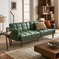 a living room with a couch, coffee table and bookshelf in the background