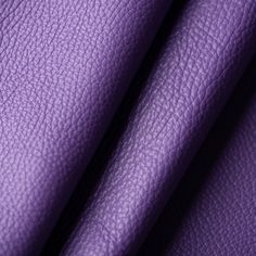 purple leather textured up close to the camera