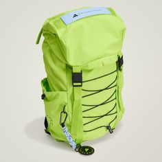 a neon green backpack sitting on top of a white table