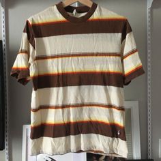 Vintage Hang Ten Striped Tee It's In Excellent Condition Measurements Lying Flat: 19" Pit To Pit 25" Top Of Shoulder To Bottom Hem Feel Free To Ask Questions :) Retro Cotton Short Sleeve Tops, Retro Brown Cotton Shirt, Brown Retro Top With Relaxed Fit, Retro Striped Streetwear Tops, Retro Crew Neck Top With Relaxed Fit, Retro Striped Tops For Streetwear, Brown Cotton Graphic Tee, Vintage Brown Crew Neck Top, Relaxed Fit Brown Shirt With Crew Neck