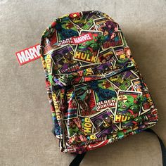 Bioworld Marvel Comics Kids Backpack All-Over Print 2 Separate Zippered Sections: 1 Large, 1 Front Smaller Zippered Pocket New With Tags Padded Adjustable Shoulder Straps Top Hook To Hang Backpack Comic Cover Design Of Different Marvel Characters Comic Cover Design, Marvel Accessories, Comic Cover, Kids Backpack, Comic Covers, Strap Tops, Kids Backpacks, Marvel Characters, Kids Accessories