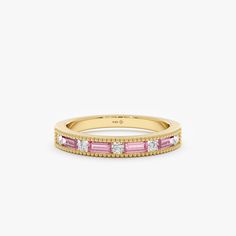 Celebrate everlasting love with the Pink Sapphire Eternity Ring, a captivating symbol of enduring commitment. This exquisite ring features a continuous band of alternating baguette-cut and round pink sapphires, meticulously set in gleaming 14k or 18k solid gold. The harmonious blend of shapes and the delicate pink hues create a romantic and sophisticated statement piece. - Handmade - Solid Gold  - Natural Diamond and Pink Sapphire  - G Color, SI Quality Diamonds - Total Sapphire Carat Weight: 0. Sapphire Eternity Ring, Solid Gold Bracelet, Pink Sapphire Ring, Half Eternity Ring, Beautiful Gift Wrapping, Vision Boards, Jewelry Lookbook, Solid Gold Rings, Everlasting Love