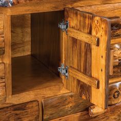 a close up of a wooden cabinet with metal handles