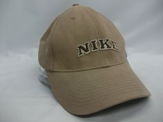 Up for sale is this Nike Hat  Beige Stretch Fit Baseball Cap The hat is in gently worn condition Nike Adjustable Dad Hat With Curved Brim, Nike Baseball Cap Snapback, Nike Dad Hat With Curved Brim, Nike Adjustable Snapback Baseball Cap, Nike Adjustable Snapback Hat, Nike Adjustable Dad Cap, Adjustable Nike Baseball Cap, Nike Curved Brim Baseball Cap For Outdoor, Nike Outdoor Baseball Cap With Curved Brim