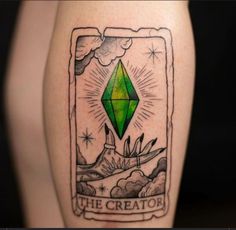 a green diamond tattoo on the leg