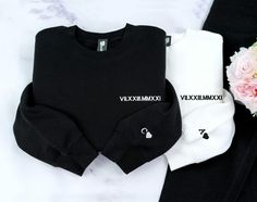 If no thread color is provided, we will use black thread for light colored shirts, and White thread for dark colored shirts. This embroidered crewneck sweatshirt or hoodie has roman numerals on the chest and a heart with initial on the sleeve. ⁕This embroidered Roman numeral sweatshirt is a meaningful and unique gift for your loved ones. Whether it's for a personalized anniversary gift, couples' engagement present, or a birthday surprise, this cozy sweatshirt is perfect for both men and women. W Black Long Sleeve Sweatshirt With Custom Embroidery, Black Sweatshirt Winter Gift, Black Long Sleeve Top With Custom Embroidery, Black Crew Sweatshirt With Embroidered Text, Black Crew Top With Custom Embroidery, Black Crew Neck Sweatshirt With Letter Embroidery, Black Crew Neck Sweatshirt For Gift, Black Embroidered Text Sweatshirt Crew Neck, Black Top With Custom Embroidery For Winter